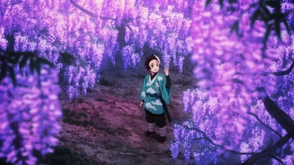 Personnage sous une glycine en fleurs